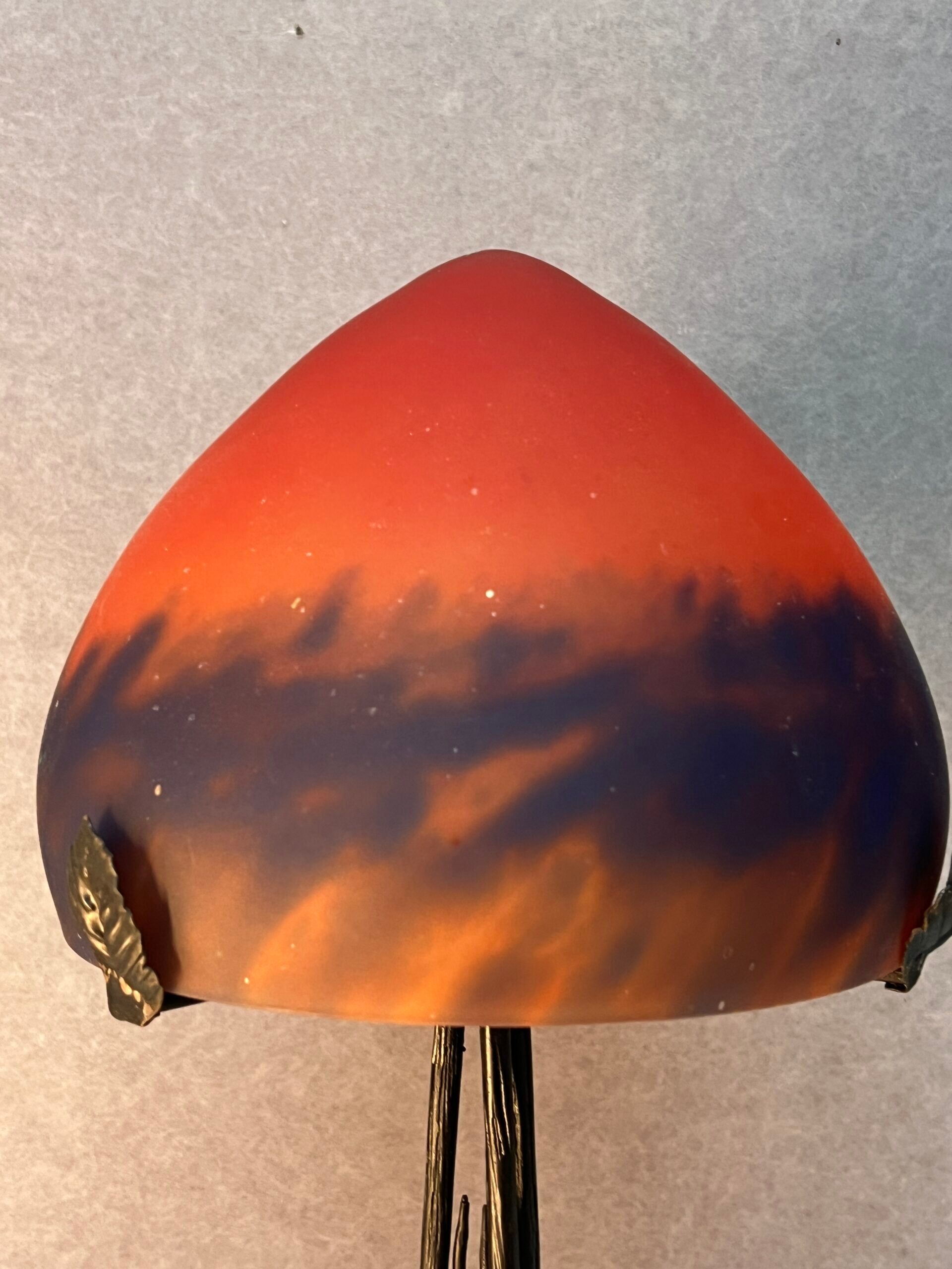 Contemporary mushroom lamp, wrought iron base and orange glass shell with blue hues in the art deco style