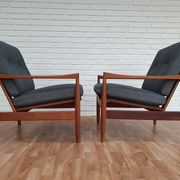 A pair of Danish armchairs, teak, wool, leather
