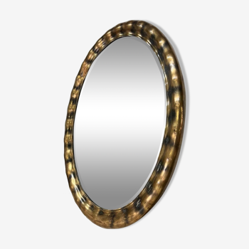 Golden oval mirror