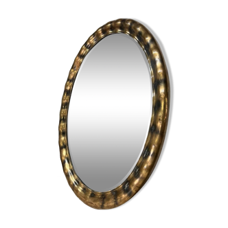 Golden oval mirror