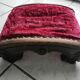 Red velvet footrest or prie-dieu