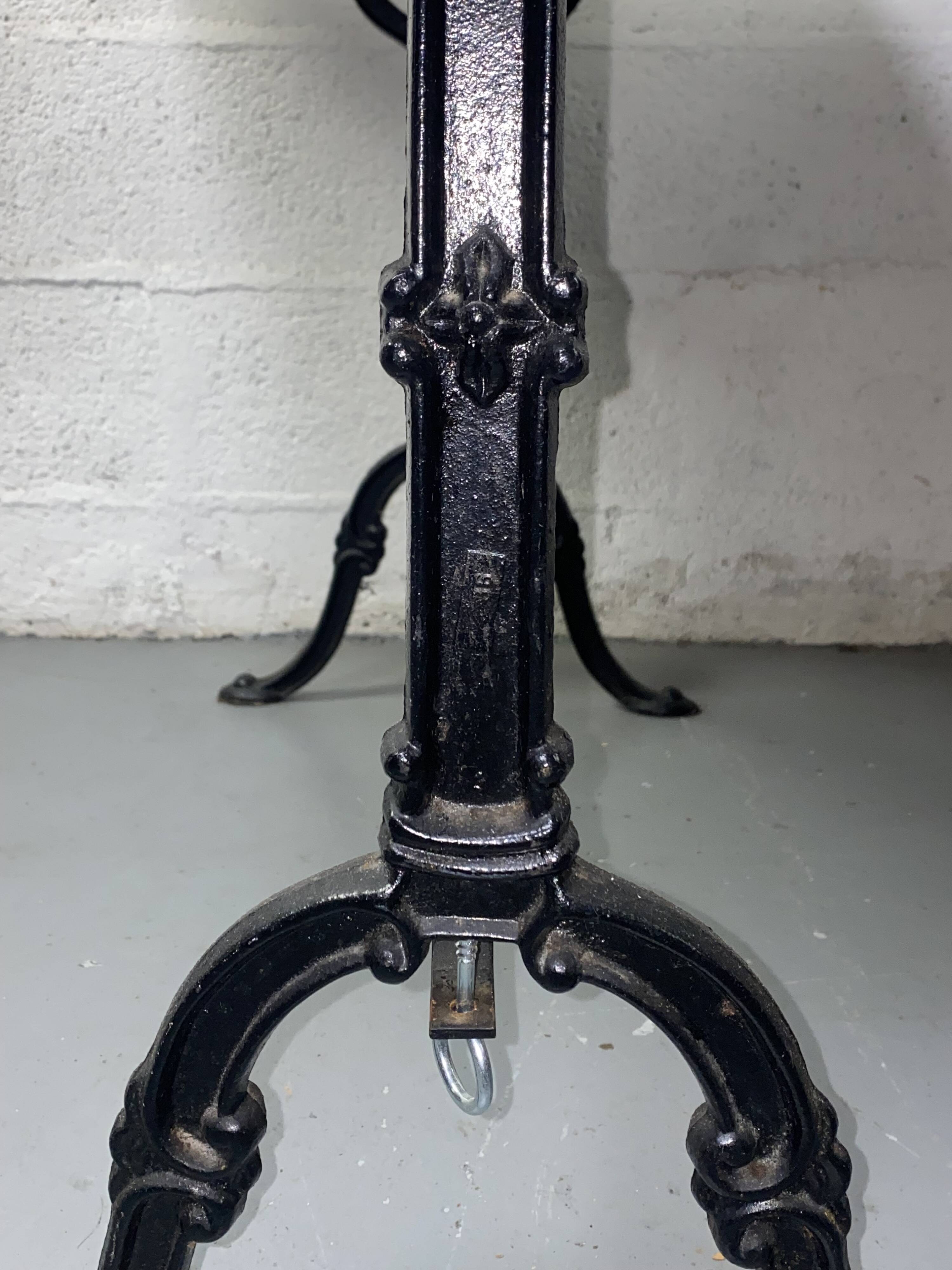 Set of two bistro tables in marble and wrought iron