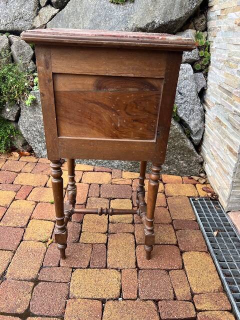Wooden bedside table with marble top