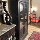 Blackened wooden display cabinet from the late 19th or early 20th century.
