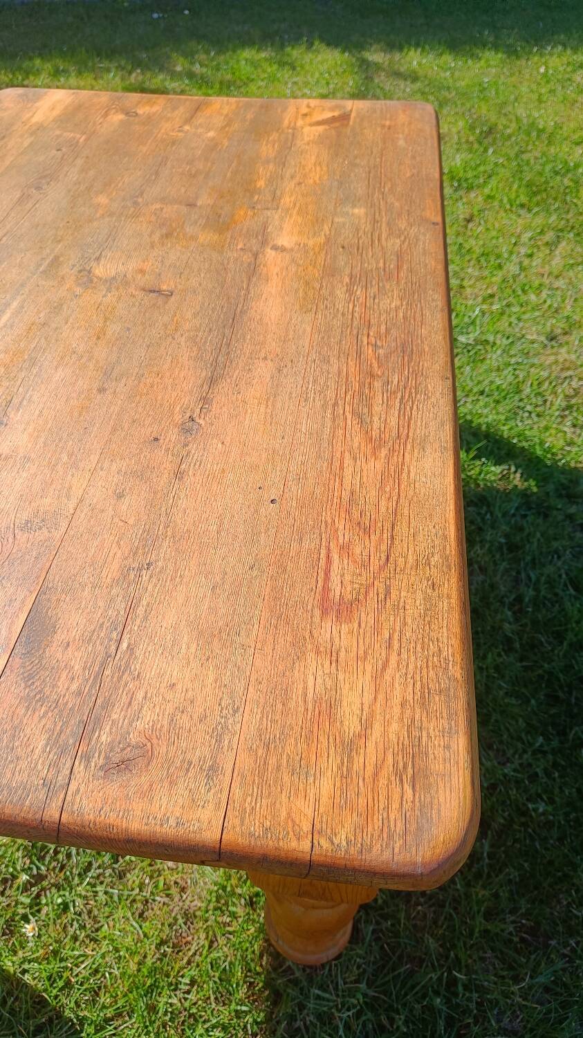 Solid oak coffee table with turned legs.