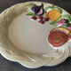 Vintage plate in ceramic enamelled decoration of fruits in relief