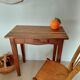 Small antique solid wood table in chic country style with a drawer.