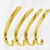 Up to four mid-century brass wall hooks by Herta Baller, Austria, 1950s.