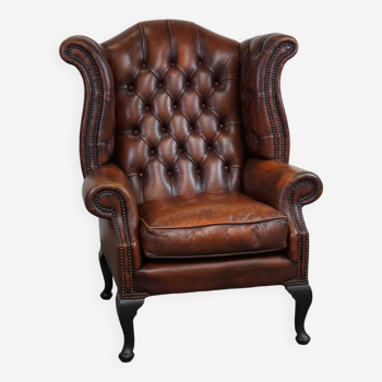 Timeless cognac-colored English cowleather Chesterfield wingback armchair in good condition