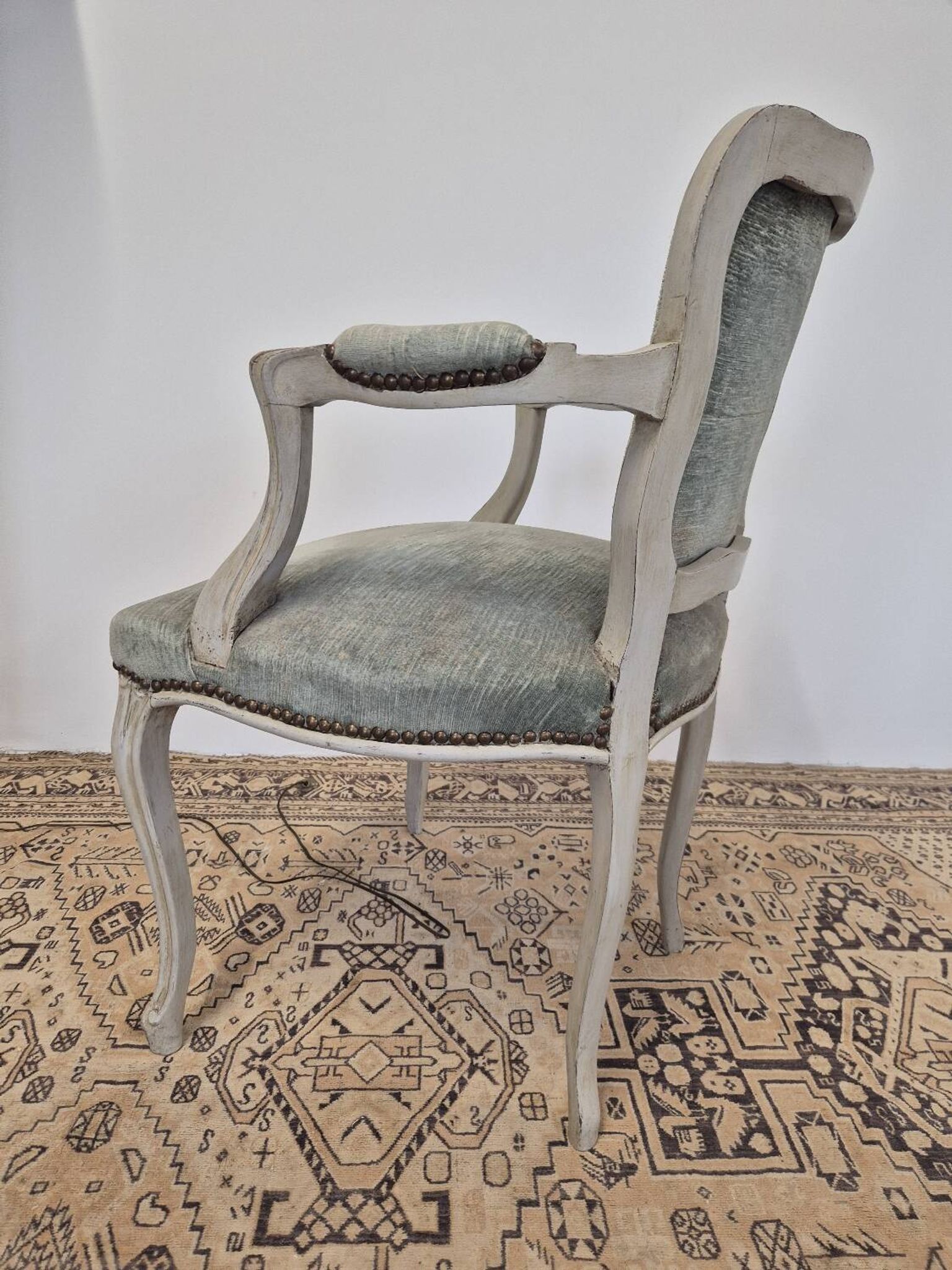 Louis XV style cabriolet armchair in patinated wood and velvet