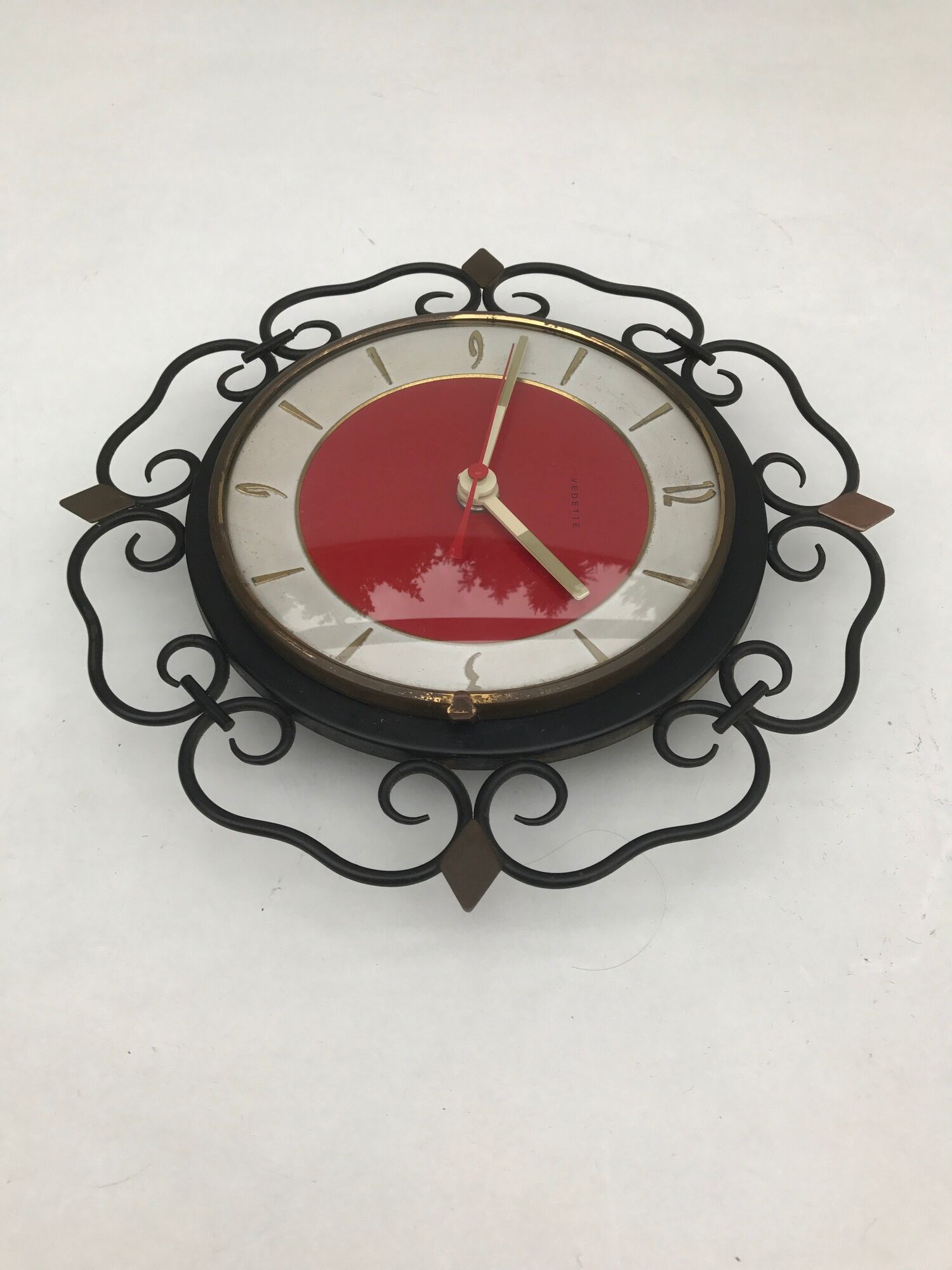 Pendulum clock old featured in metal and vintage copper spikes