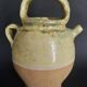 Yellow glazed terracotta gargoulette carafe with lid, early 20th century.