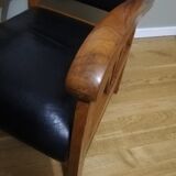 Colonial armchair in teak and black leather