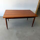Rectangular extendable dining table with Scandinavian design in teak.