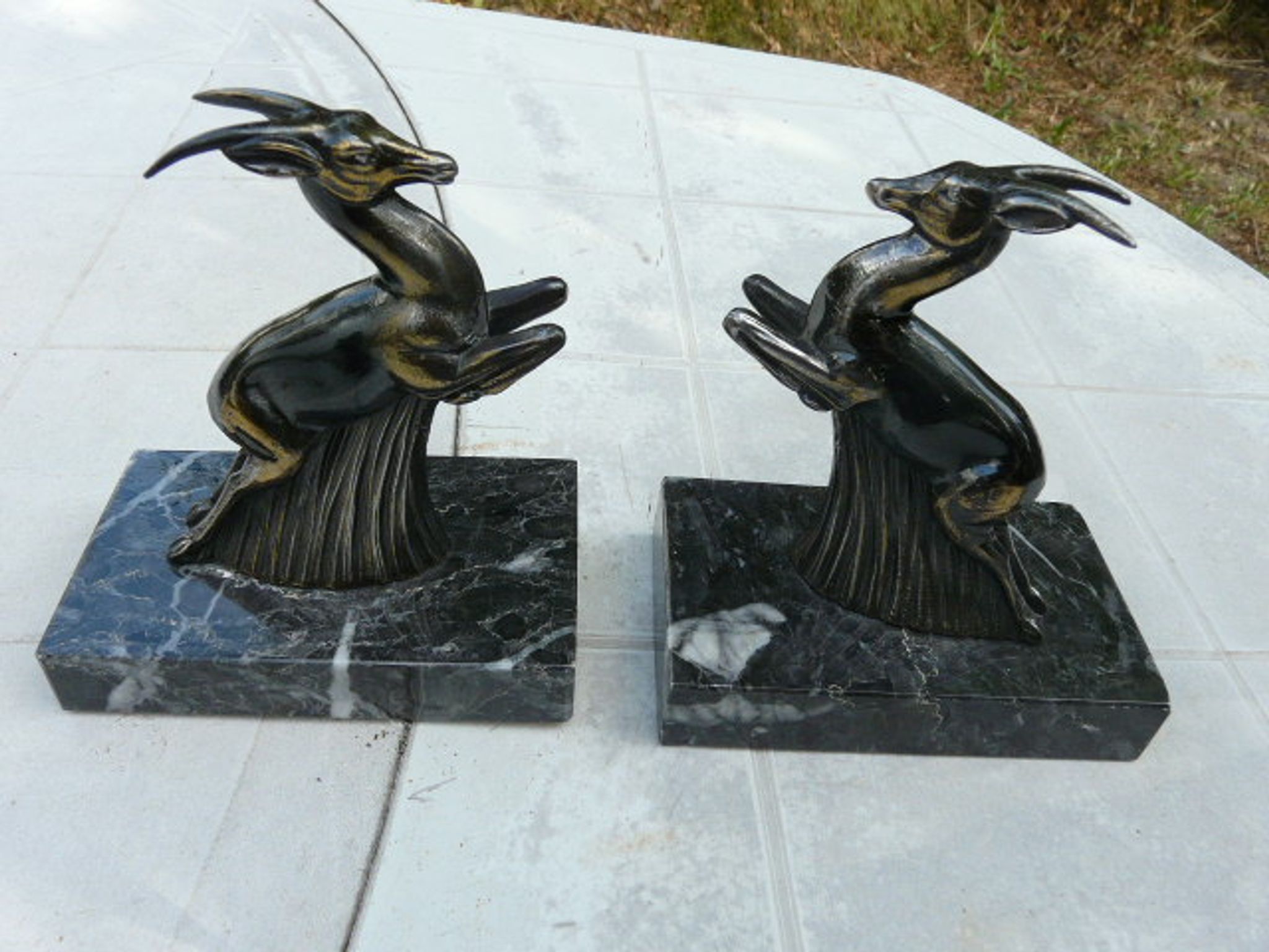 Pair of greenhouse book antelope in regulation on marble base