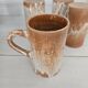 Set of 5 vintage handcrafted stoneware mugs in beige, pink, and white glazed stoneware