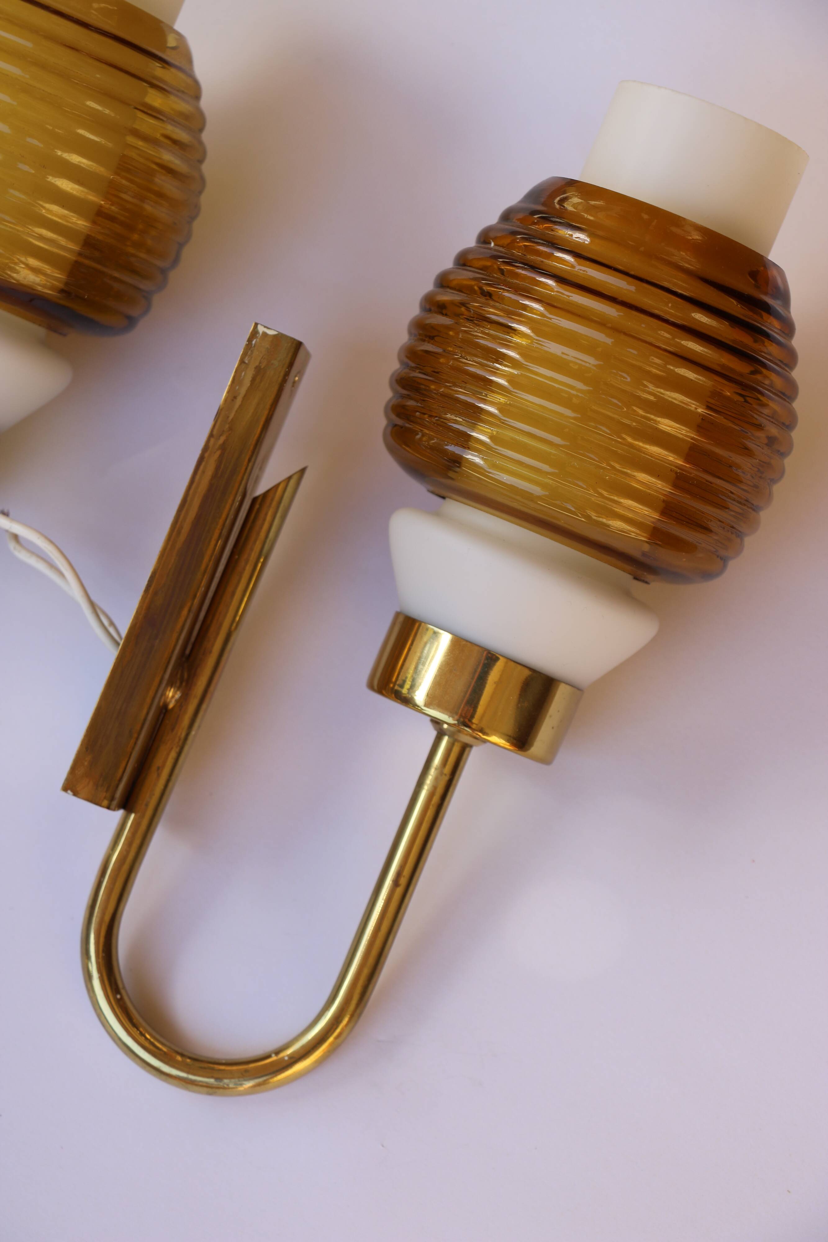 Pair of Scandinavian wall sconces, brass, opal glass and amber glass.