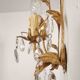 Hand-forged wall lamp gilded with gold leaf and crystals, Italy