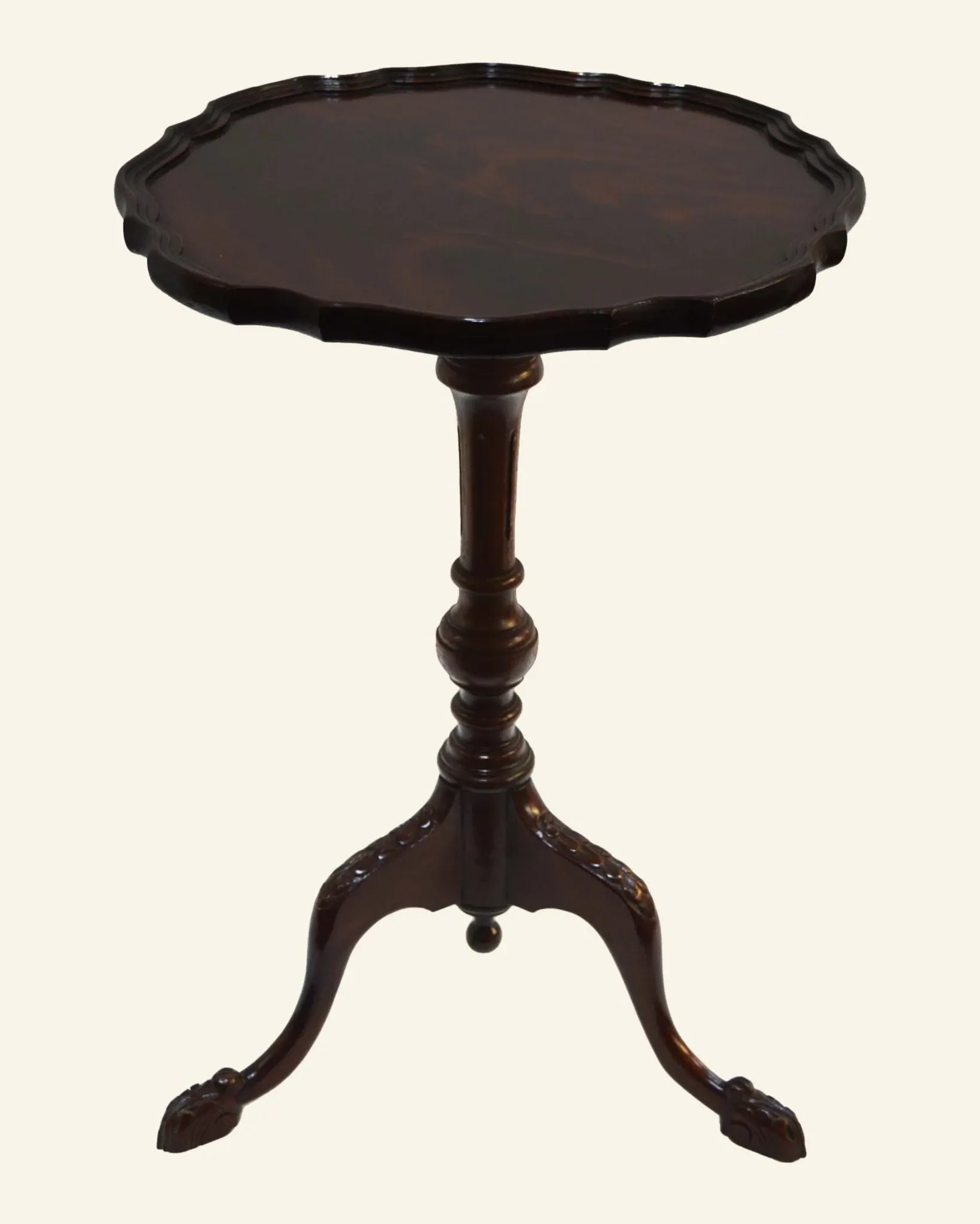 African mahogany guéridon, turned with a sculpted tripod leg.