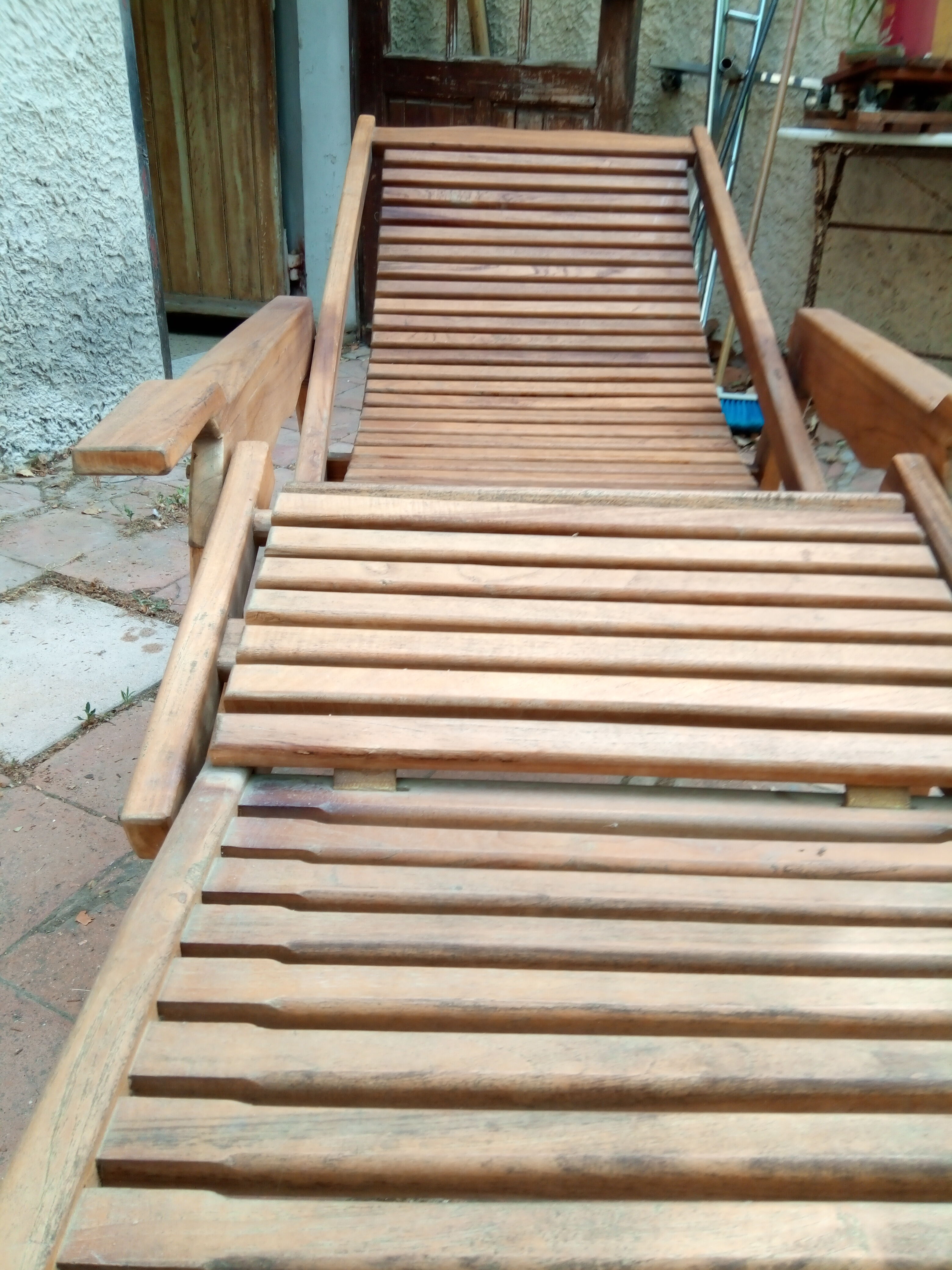Teak stretchy long chair.