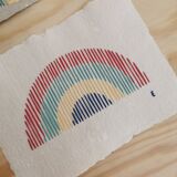 Rainbow embroidery on recycled paper