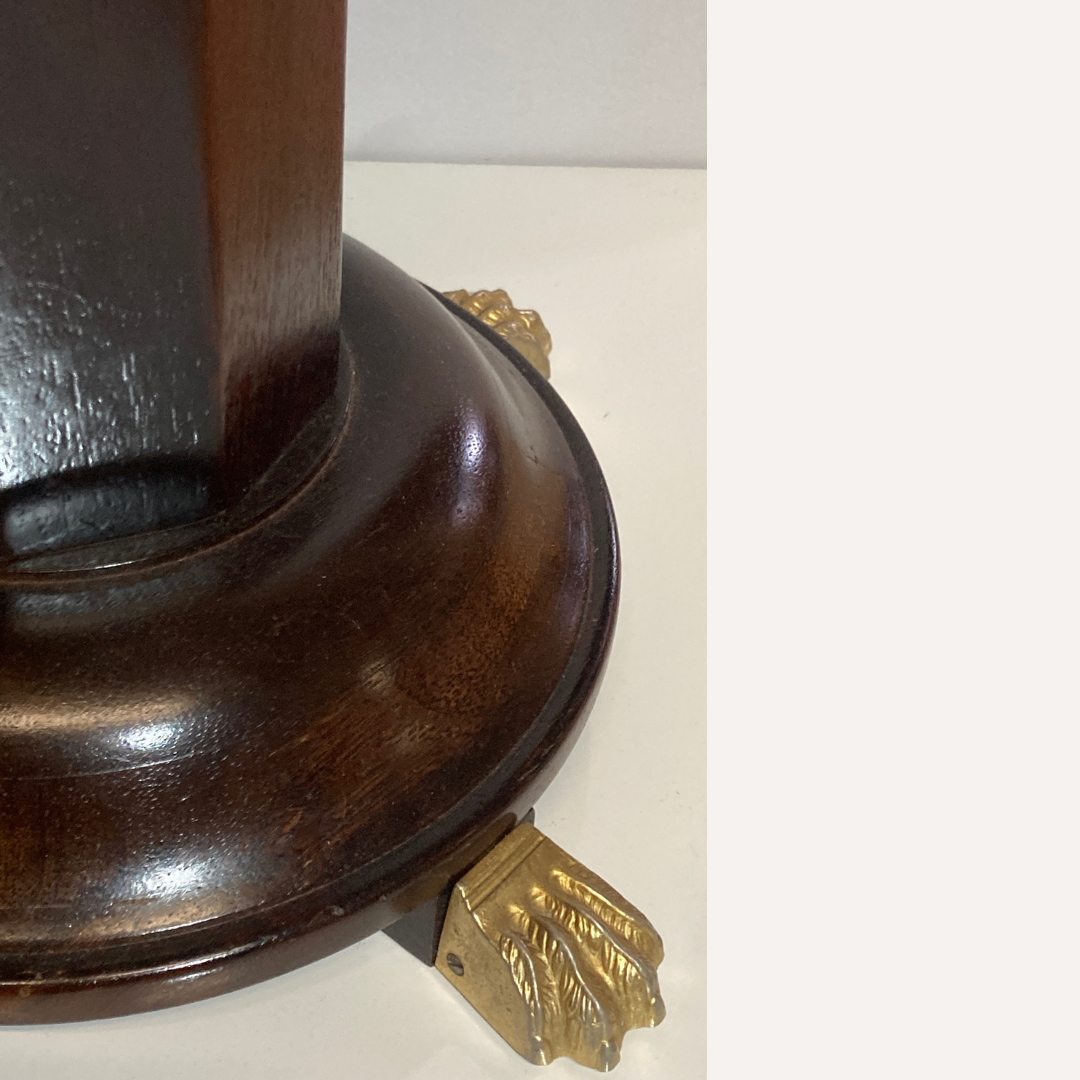 Vintage mahogany pedestal or side table with brass claw feet
