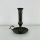 Vintage brass candlestick that raises and lowers.
