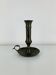 Vintage brass candlestick that raises and lowers.