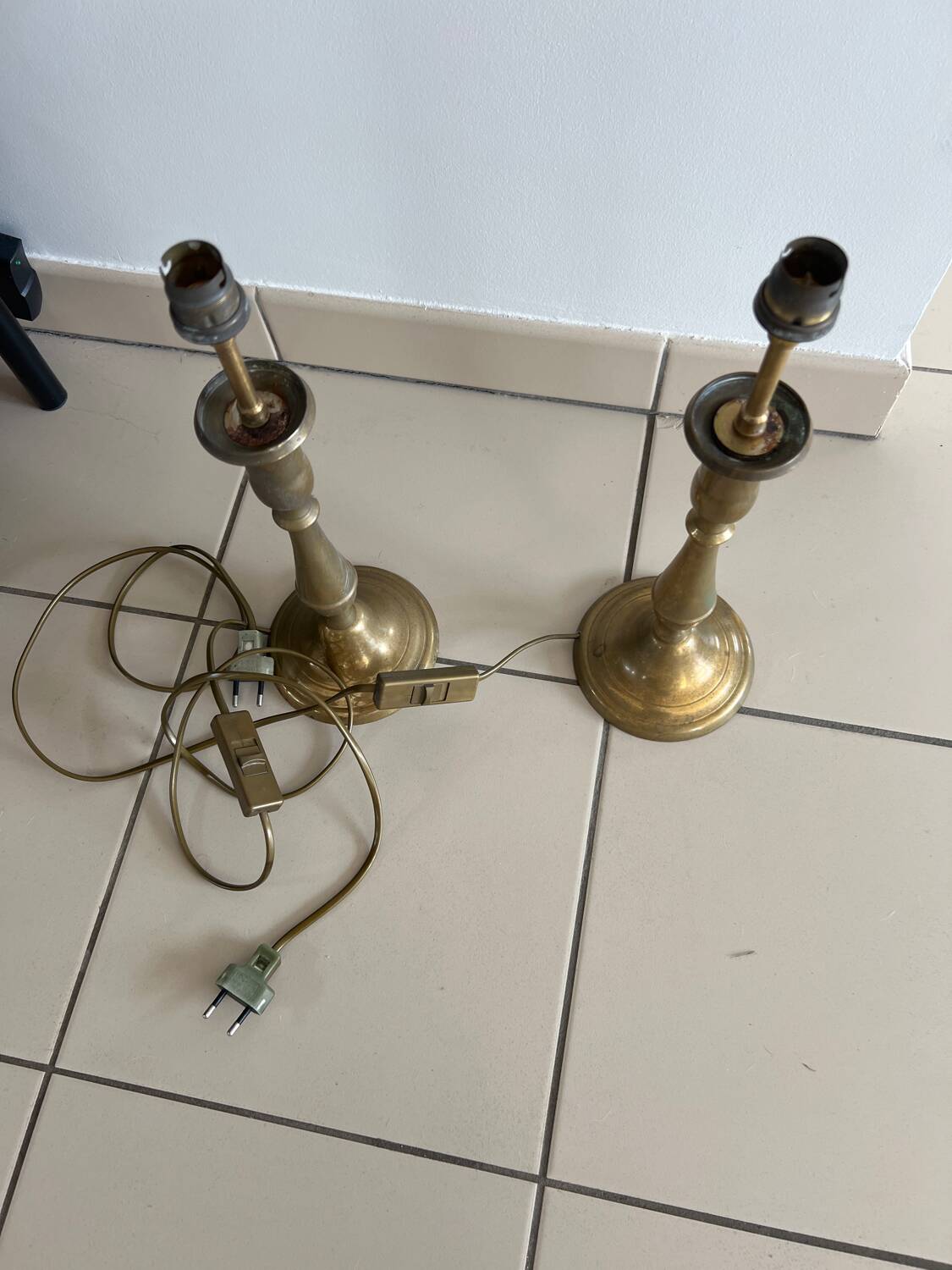 Two brass bedside lamps