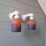 Pair of Art Deco wall sconces in multicoloured porcelain and frosted glass.