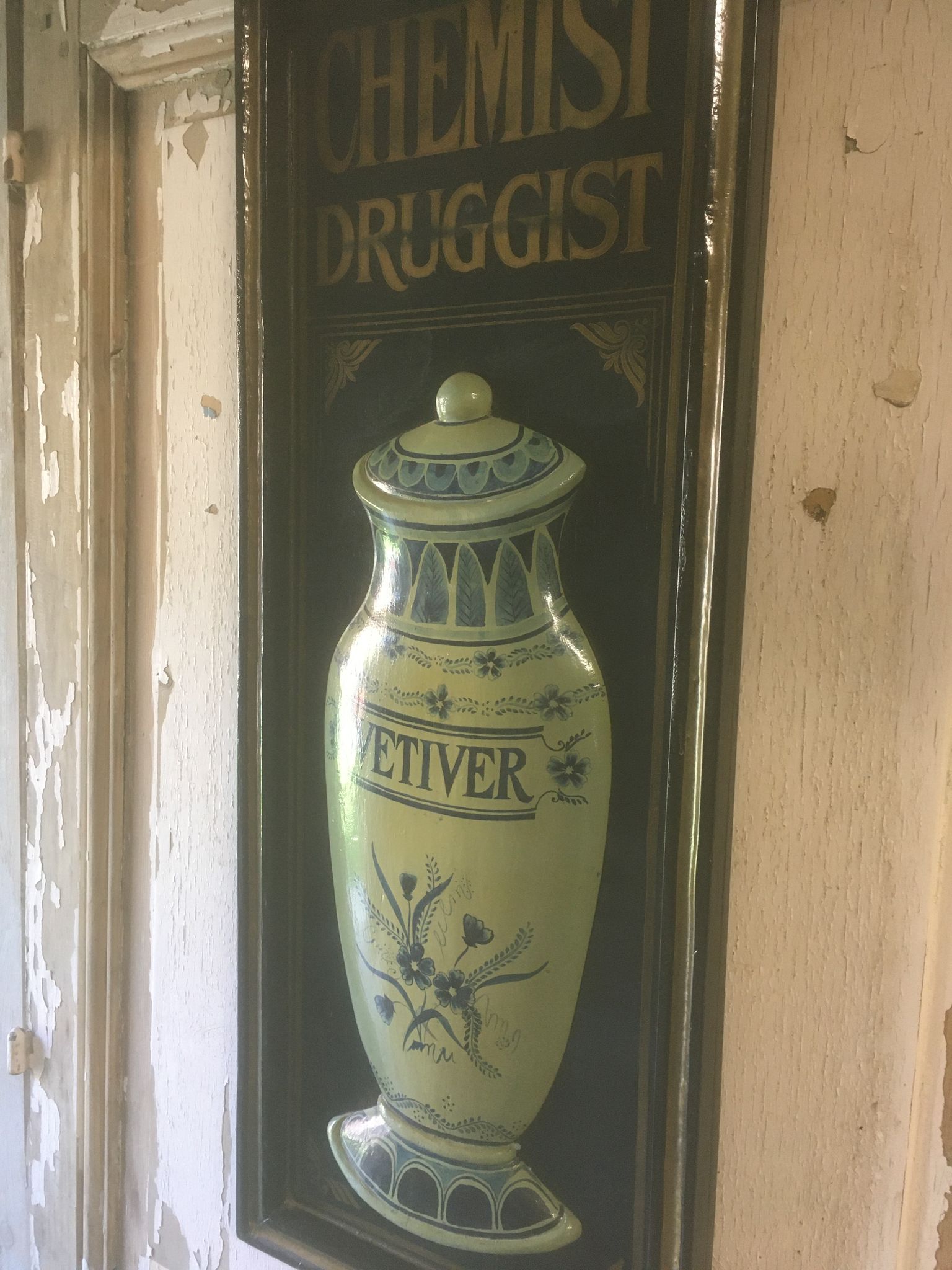 Wooden relief panel "Chemist Druggist" from Country corner