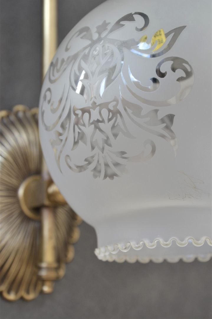 Pair of engraved glass wall lamps, brass support