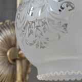 Pair of engraved glass wall lamps, brass support