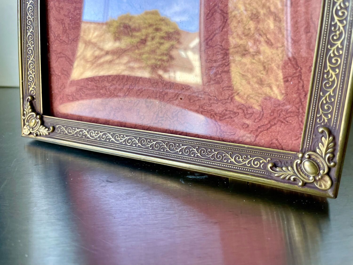 Metal frame in gold colored brass