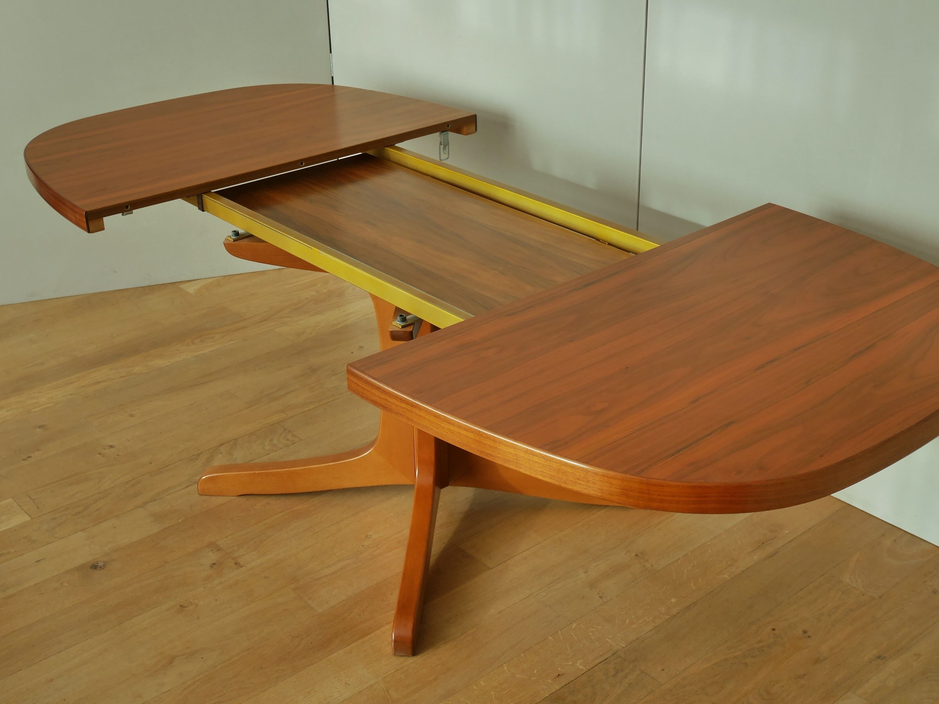 Oval walnut table with extension cords