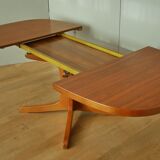 Oval walnut table with extension cords