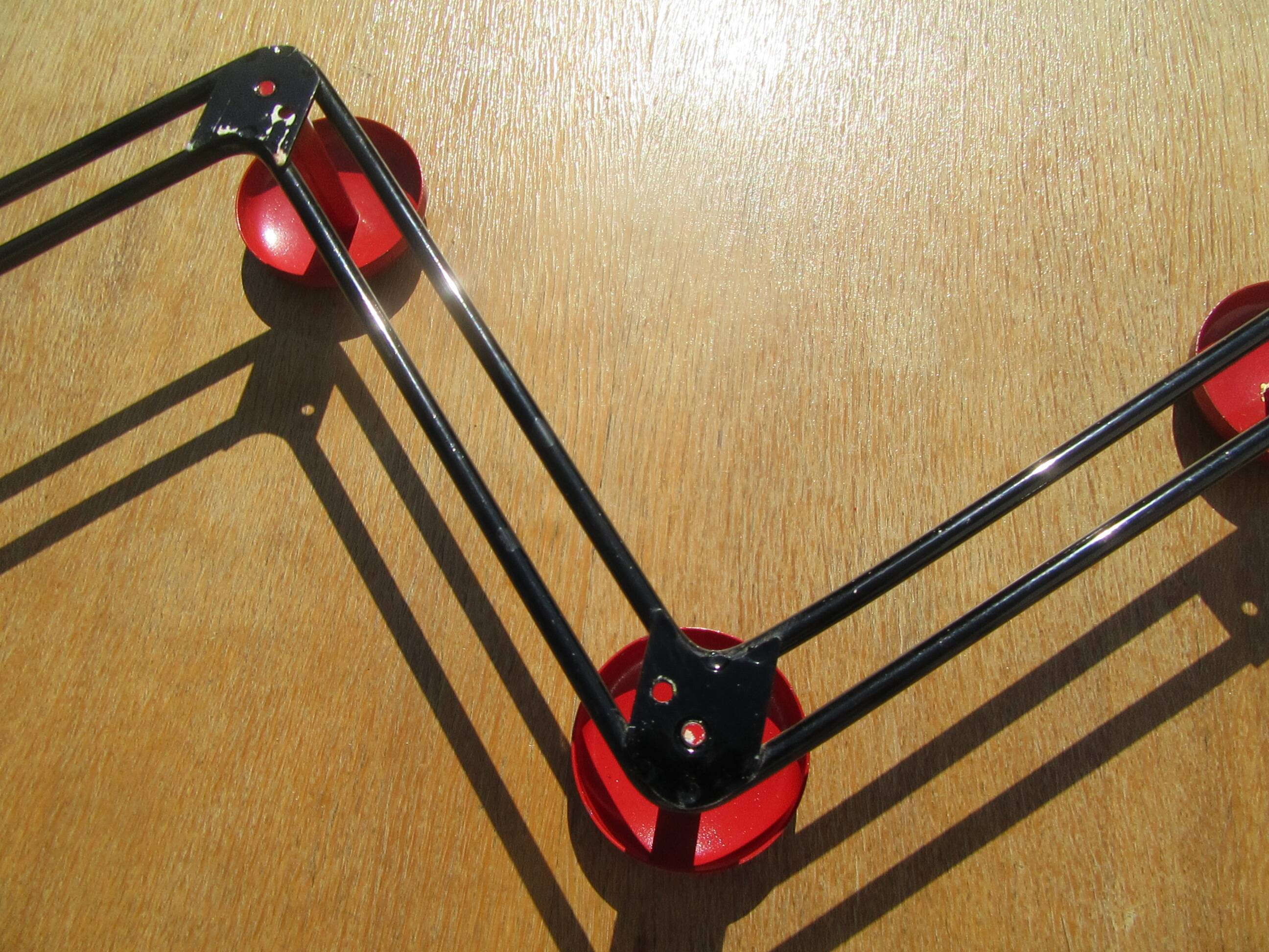 vintage black and red iron coat rack