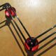 vintage black and red iron coat rack