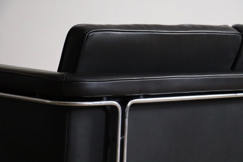 Horst Brüning Model 6912 two seater sofa in black leather for Kill International, Germany 1967