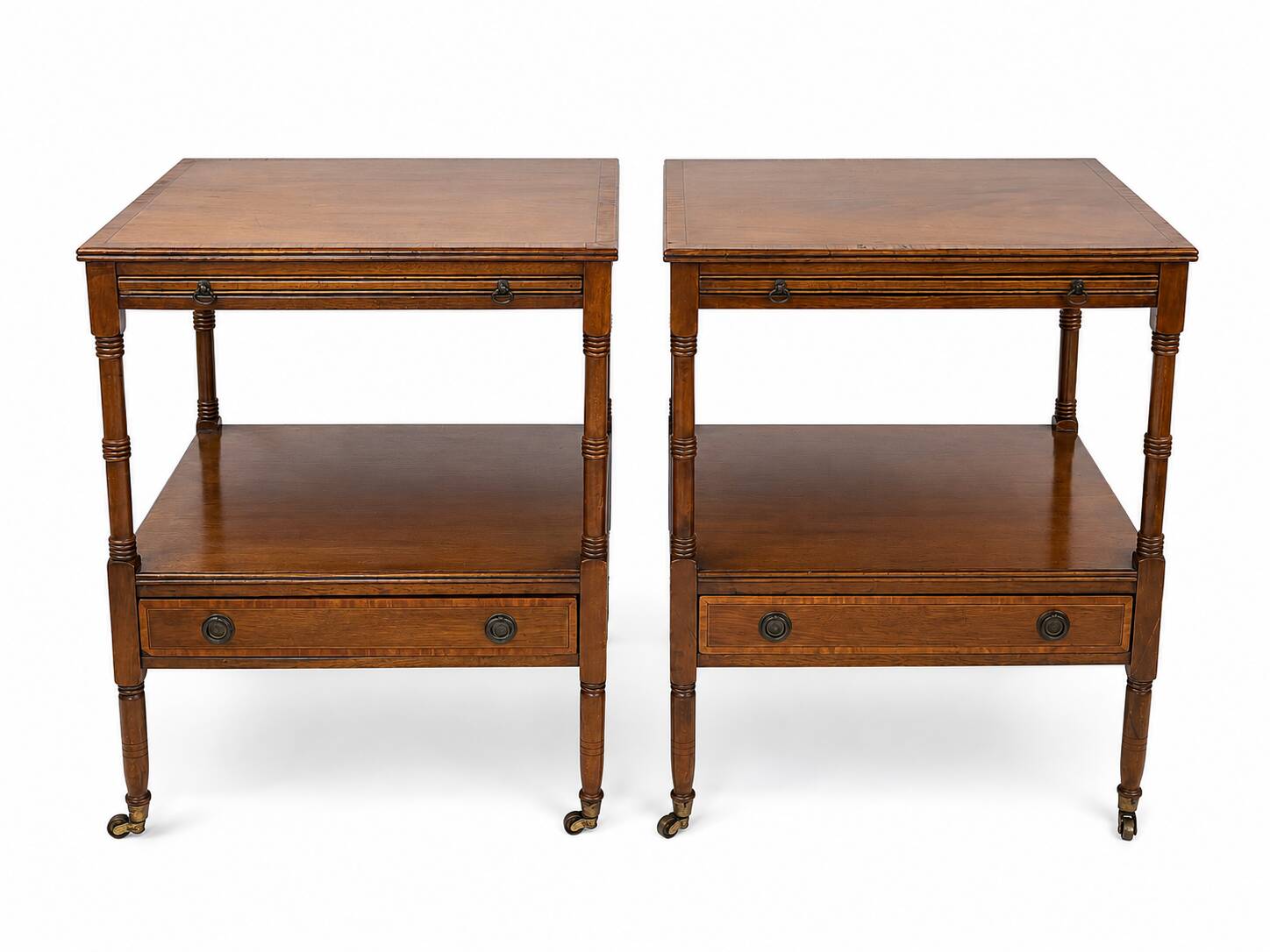 Pair of English mahogany side tables with sliding shelf.