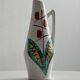 Ceramic pitcher with hand painted floral pattern