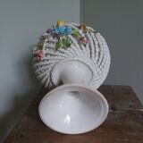 Cup on woven ceramic base with slip flowers