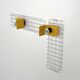 Pair of yellow wall sconces on wire mesh by Seccose, 1980
