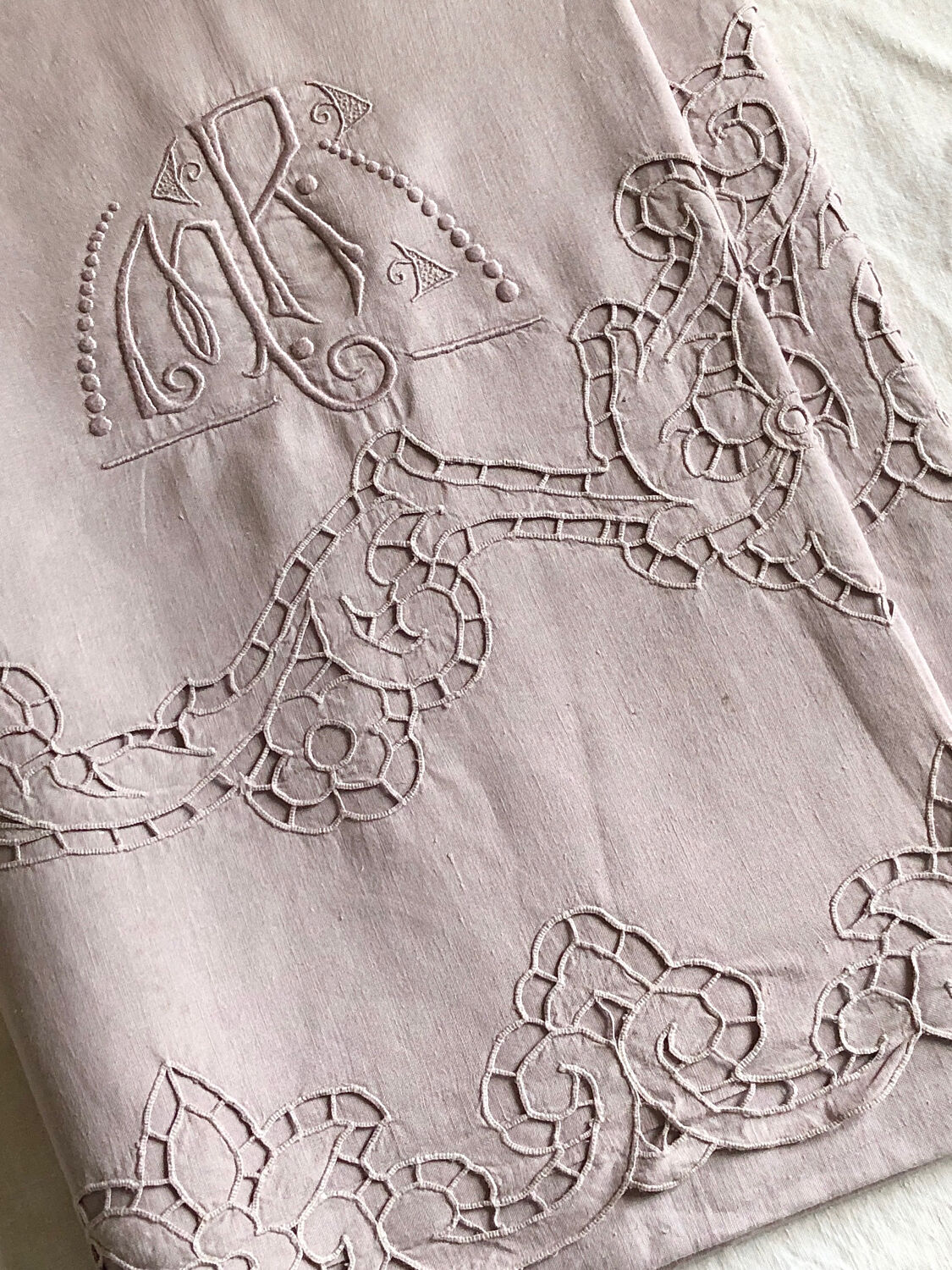 Old embroidered towel tinted purple aurora