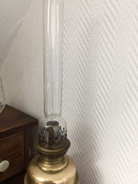 Old-fashioned brass standing oil lamp