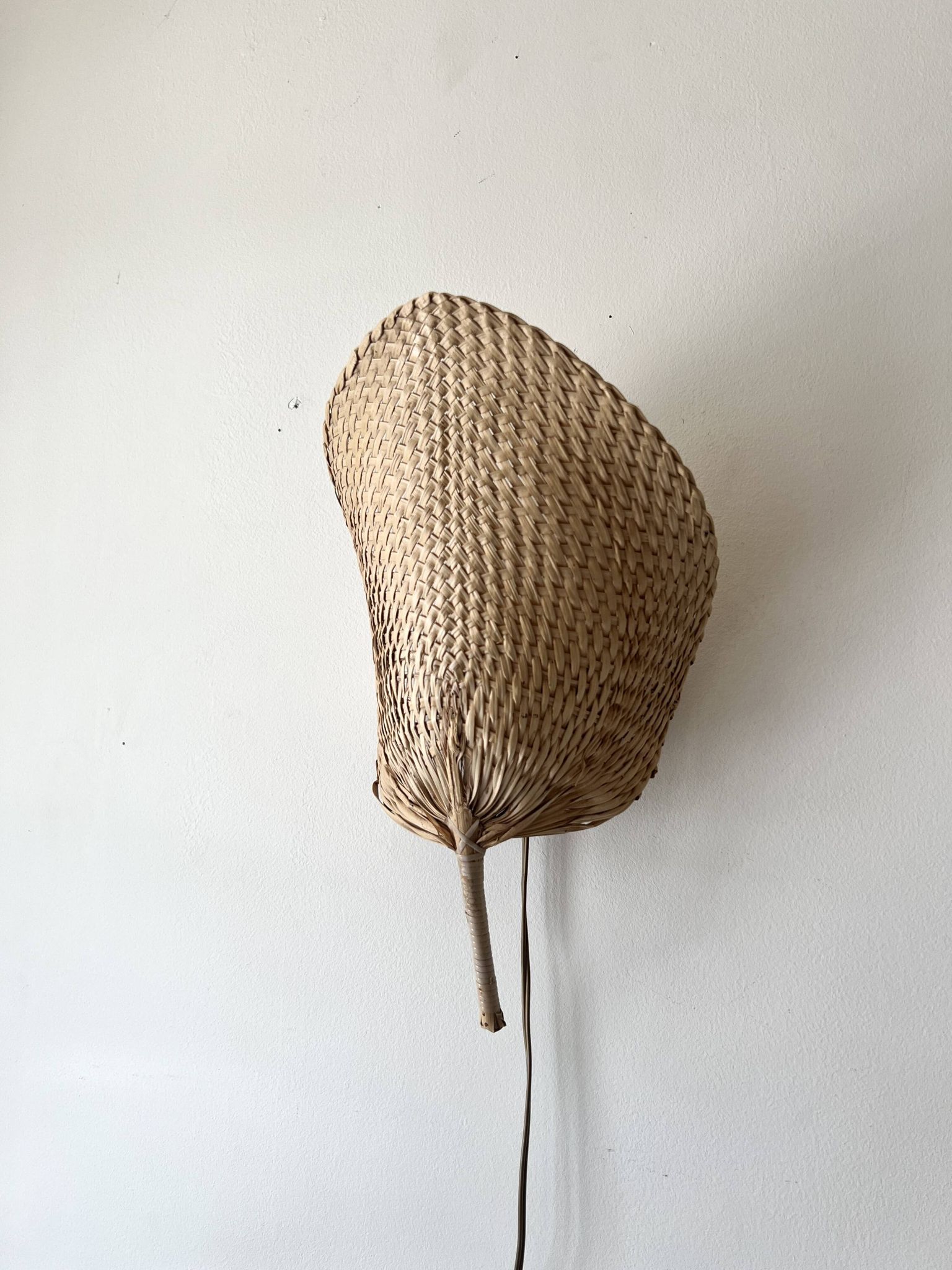 Woven rattan wall light in the style of Igno Maurer, design from the 1970s.