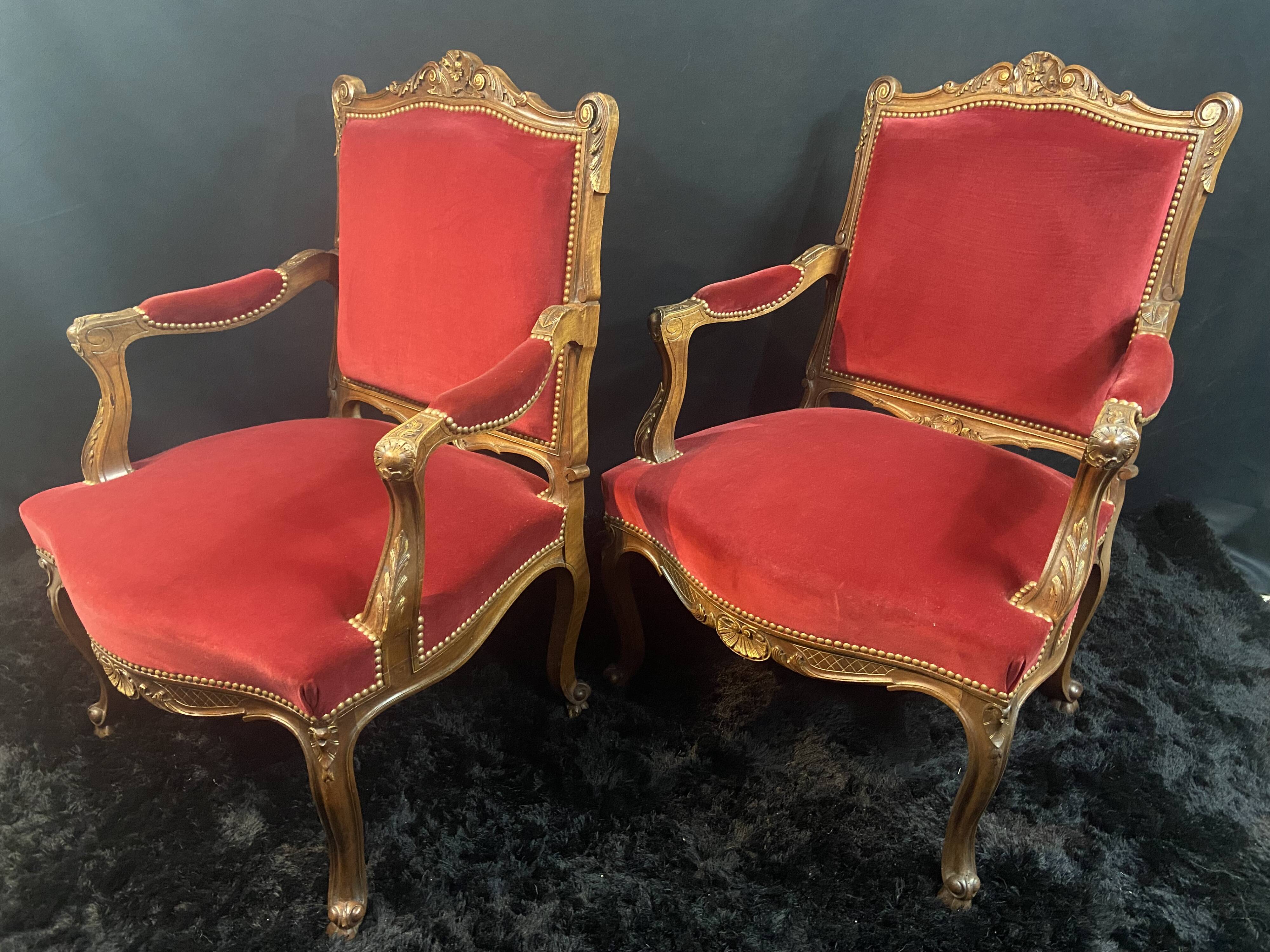Pair of flat-back armchairs in Louis XV style in red velvet.