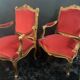 Pair of flat-back armchairs in Louis XV style in red velvet.