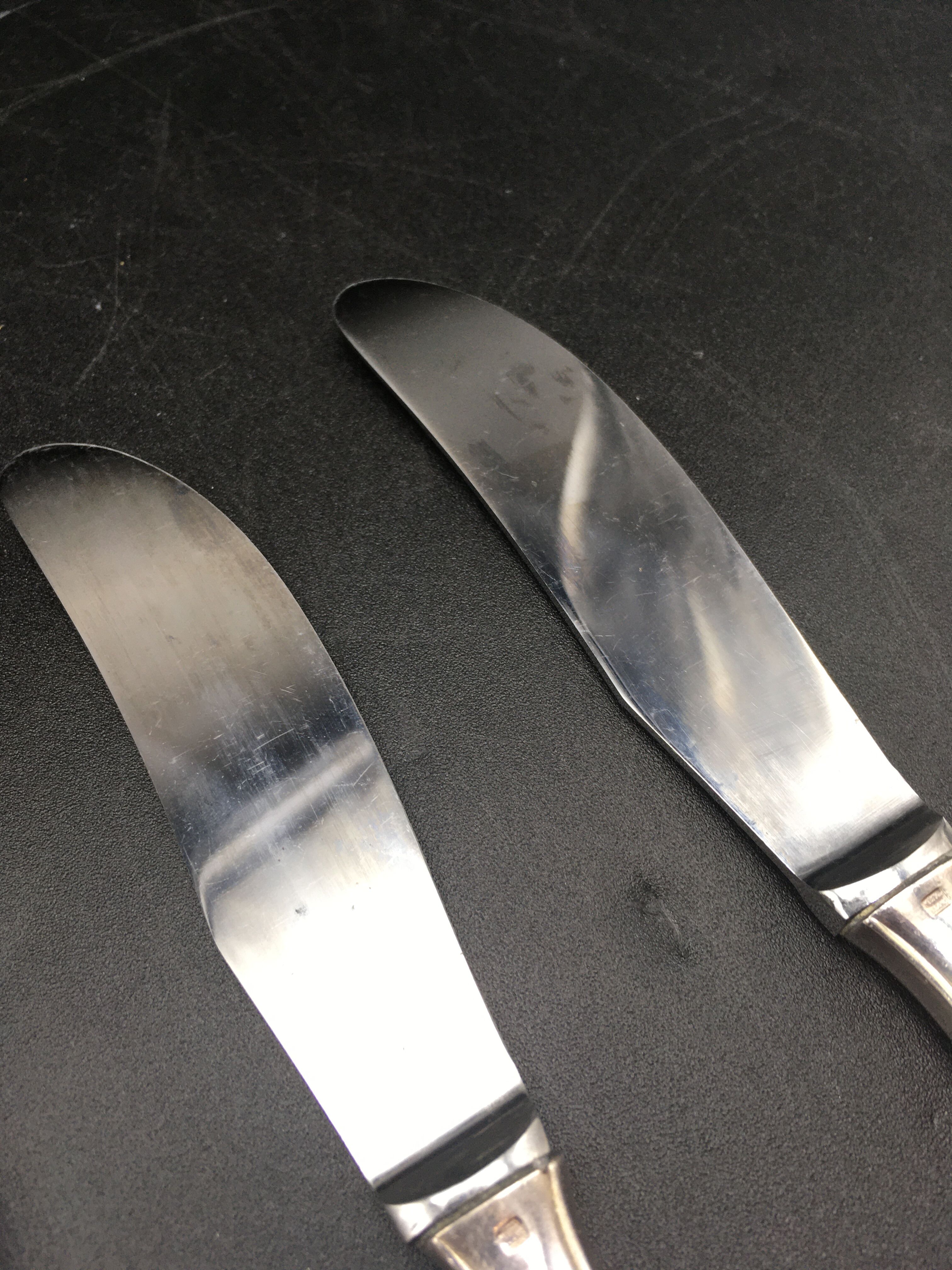 12 silver metal knives
