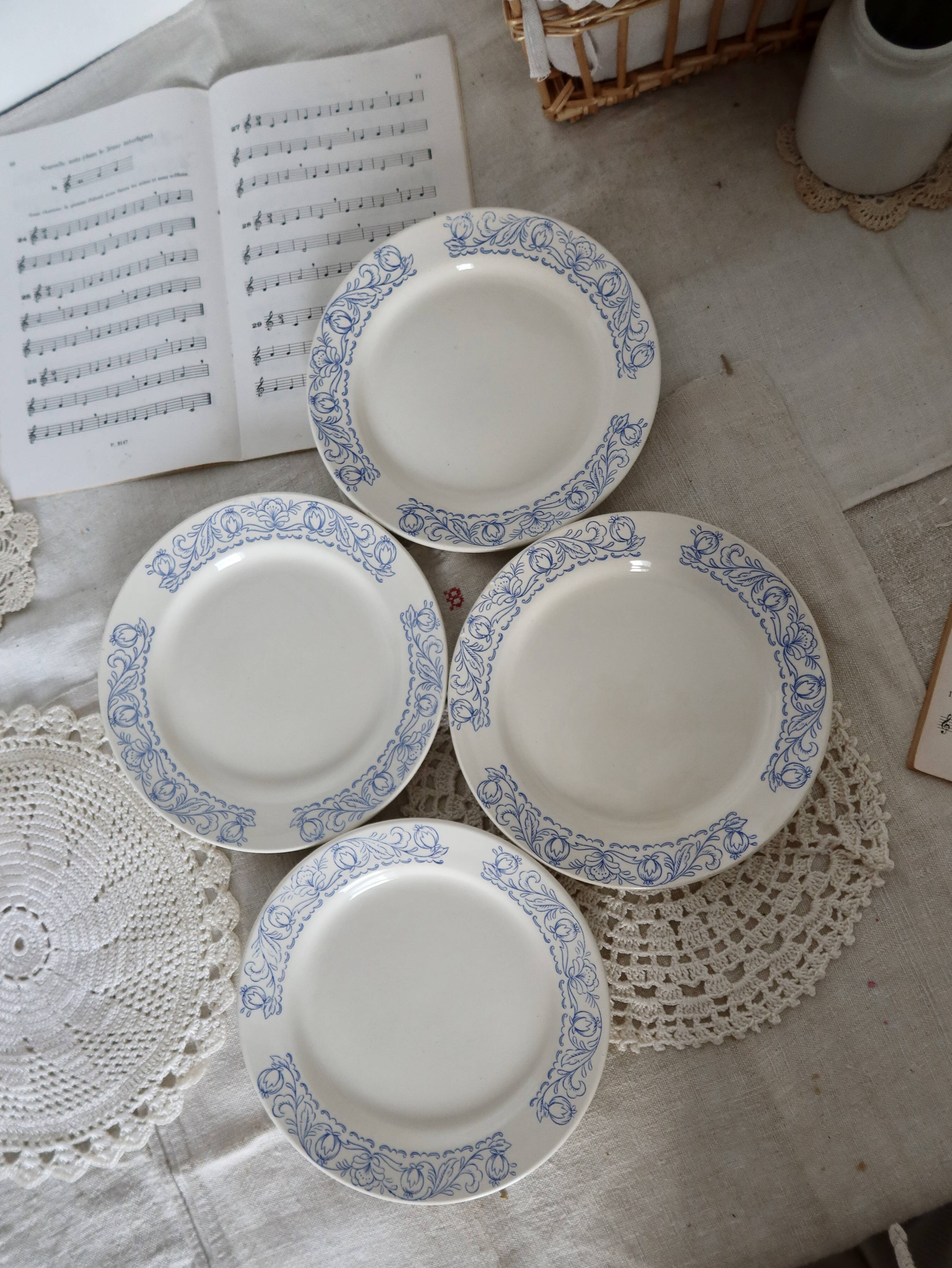 4 vintage porcelain dessert plates with blue border